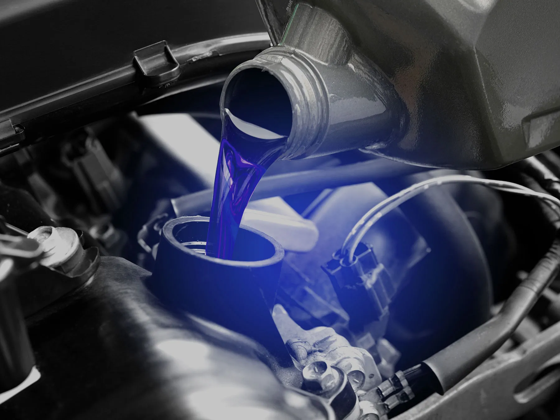 Oil change during a vehicle being serviced at West Auto in Newcastle